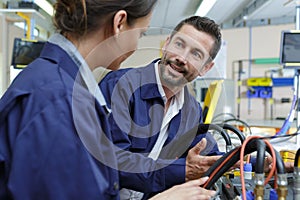 factory workers having conversation while at work