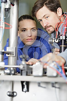 factory workers solving problem together