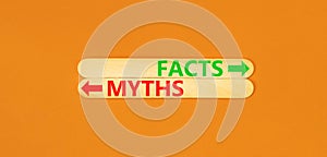 Facts or myths symbol. Concept word Myths and Facts on beautiful wooden stick. Beautiful orange table orange background. Business