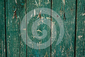Faded green old wooden planking background with flaws photo