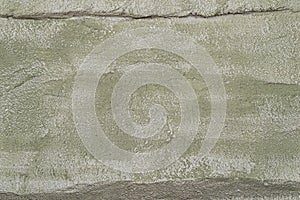 Faded light green facade wall