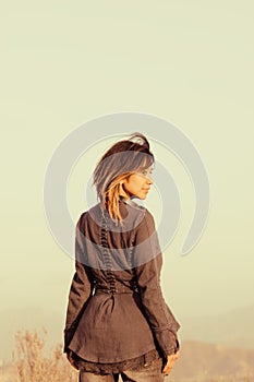 Faded portrait of woman looking over shoulder