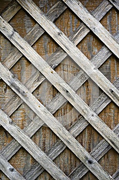 Faded wooden slats nailed to wooden plywood