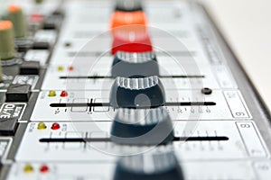 The faders are all open right on the mixing console  close-up