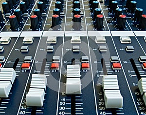 Faders on audio mixer
