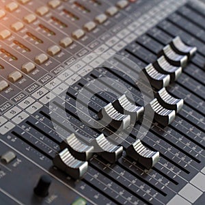 Faders and control buttons on mixing console