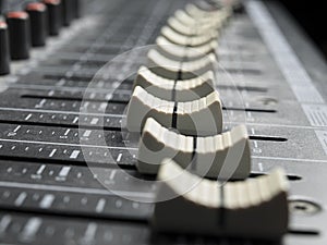 Faders on the mixing desk