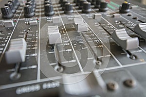 Faders and potentiometers trimmers in a mixer table