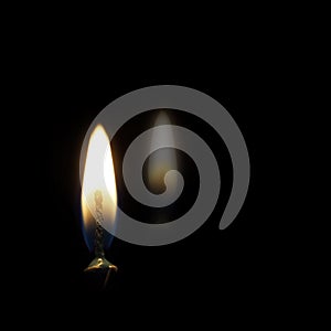 The fading of the light. Candle flame concept, metaphor. Death, dying, bereavement etc or hope. Dark background photo