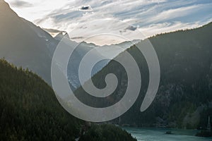 Fading Light Disappears Into The Mountains Over Diablo Lake In North Cascades photo