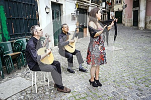 Fado band performing traditional portuguese music in Alfama, Lisbon, Portugal photo