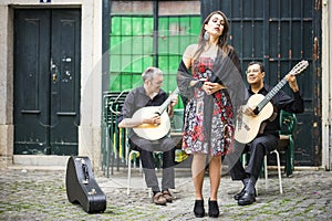 Fado band performing traditional portuguese music in Alfama, Lisbon, Portugal photo