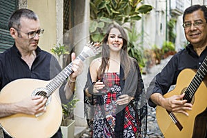 Fado band performing traditional portuguese music on the street