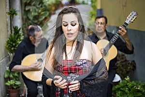 Fado band performing traditional portuguese music on the street