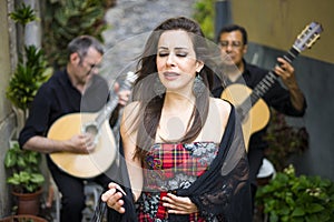 Fado band performing traditional portuguese music on the street photo