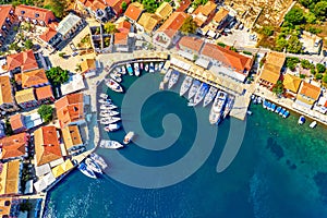 FAerial drone view of Fiscardo village port with luxury boats and yachts on Kefalonia island, Greece