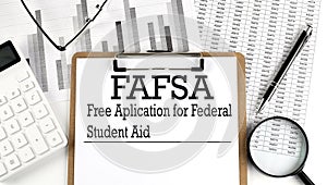 FAFSA. Free application for federal student aid. A text on clipboard on chart