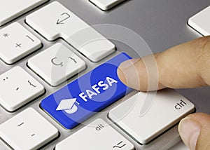 FAFSA - Inscription on Blue Keyboard Key photo