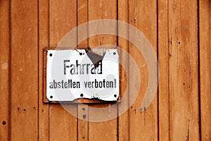 â€œFahrrad abstellen verbotenâ€ in German, parking of bicycles is prohibited old vintage cracked sign