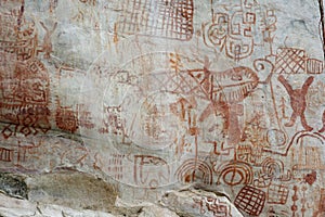 0cave paintings in San Ignacio Cajamarca Peru with hunters and warriors used boleadora stones with an antiquity of 5000 to photo