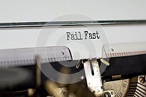 Fail fast symbol. Words `fail fast` typed on retro typewriter. Business, fail fast concept. Beautiful white background