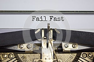 Fail fast symbol. Words `fail fast` typed on retro typewriter. Business, fail fast concept. Beautiful white background