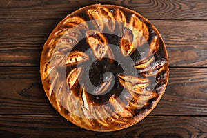 failed apple pie. burnt on top and the dough did not rise during baking. textured burnt pie crust. photo