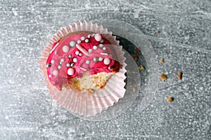 Failed cupcake on light grey table, top view. Troubles happen