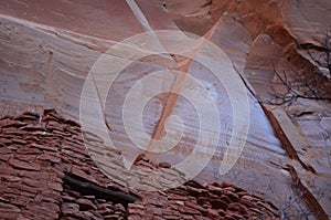Faint Rudimentary Drawings Above Cliff Dwellings on Rock Face photo