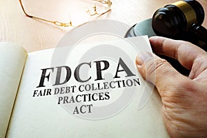 Fair Debt Collection Practices Act FDCPA on a table. photo