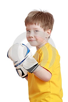 Fair-haired little boy in Boxing gloves, close-up