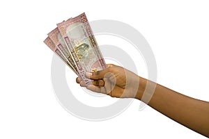 Fair hand holding 5000 Rwandan franc notes isolated on white background