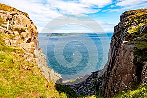 Fair Head cliff, Atlantic Ocean and Rathlin Island in Northern Ireland, UK