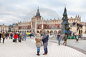 Fair in KRAKOW. Main Market Square and Sukiennice in the evening.