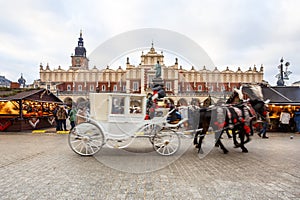 Fair in KRAKOW. Main Market Square and Sukiennice in the evening.