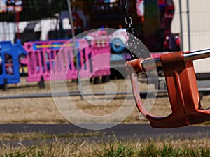 Fairground chair swing ride at fun fair medium shot