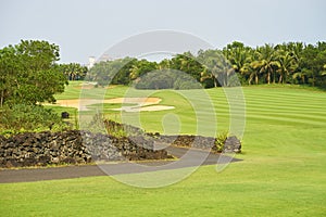 Fairway & bunkers in beautiful golf course surrounded by trees