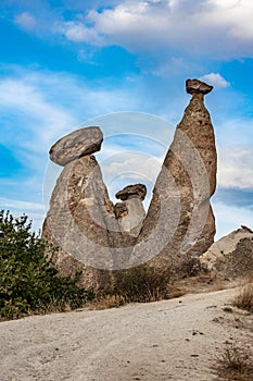 Fairy chimneys, unique rock formations near Cavusin Town in Cappadocia, Turkey