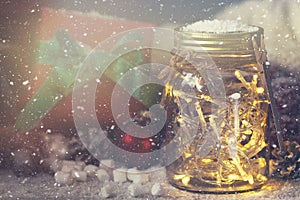 Fairy christmas holiday lights in a jar with christmas decoration, christmas or xmas concept