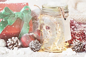 Fairy christmas holiday lights in a jar with christmas decoration, christmas or xmas concept