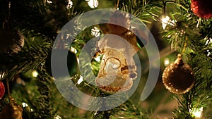 Fairy garland and Christmas ball decoration on tree with bokeh lights