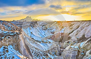 The fairy sunset over the rock castle of Uchisar, Cappadocia, Turkey