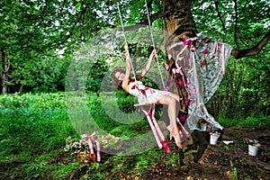 Fairy swinging on teeterboard photo