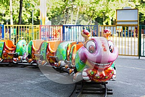 Fairy-tale figures on children\'s carousel in the city park in the morning. Nobody here. Carousels are waiting for children.