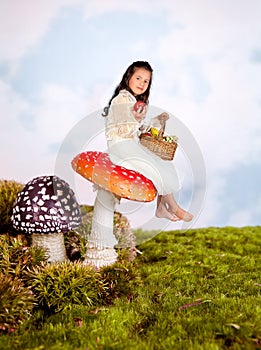 Fairy tale girl on toadstool