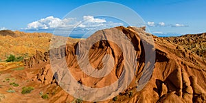 Fairy Tale rainbow canyon panorama `Skazka` in Kyrgyzstan