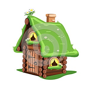 Fairytale wooden house with green grass roof