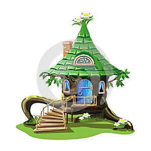 Fairy tale house in an old stump with a green roof
