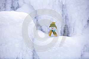 Fairytale character the snowman in hat and scarf.