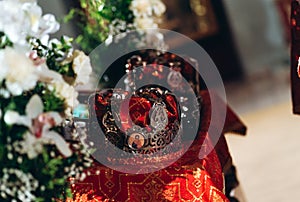 Fairytale couple, bride and groom in crowns during wedding ceremony in church